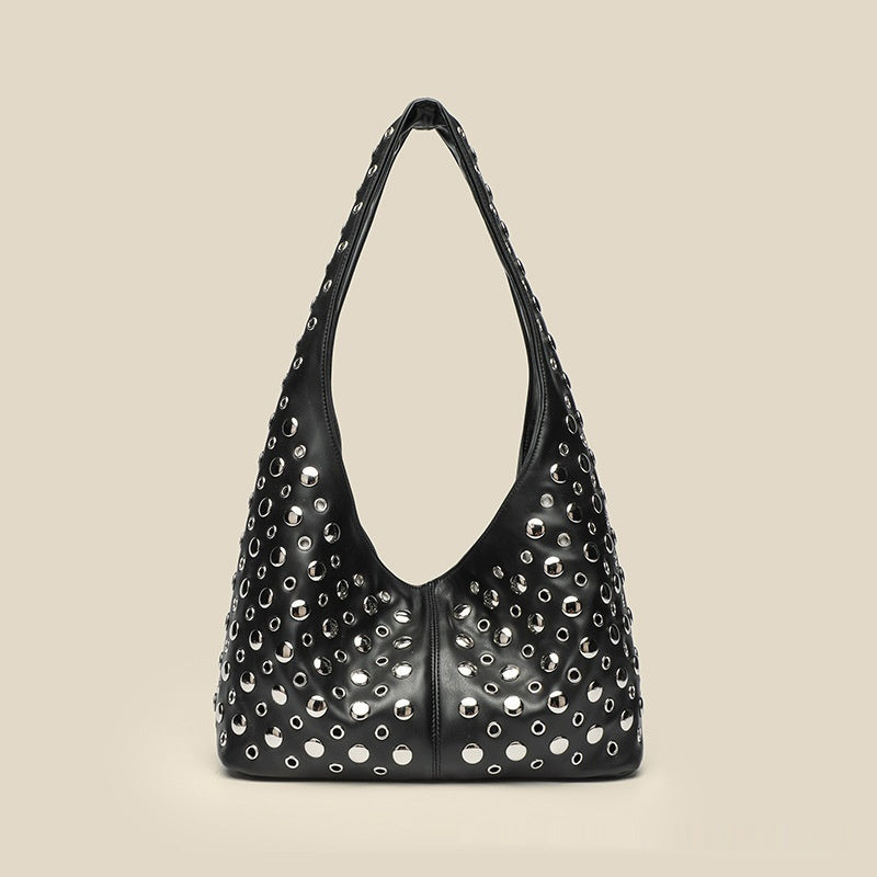 Borsa da donna alla moda con rivetti a pois