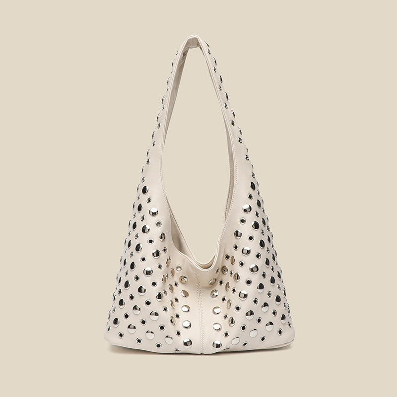 Borsa da donna alla moda con rivetti a pois