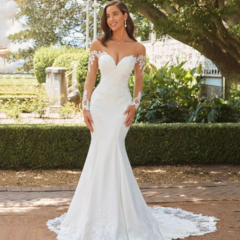 Abito da sposa a sirena in pizzo con maniche lunghe e schiena scoperta