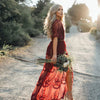 Abito lungo con scollo a V profondo e maniche corte in pizzo, effetto trasparente