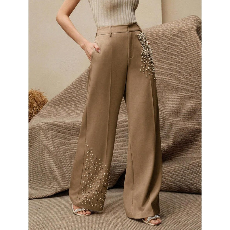Pantaloni eleganti a pieghe da donna con una tasca alla moda impreziosita da perle