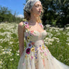 Abito da ballo in tulle color champagne chiaro con scollo a cuore e strascico