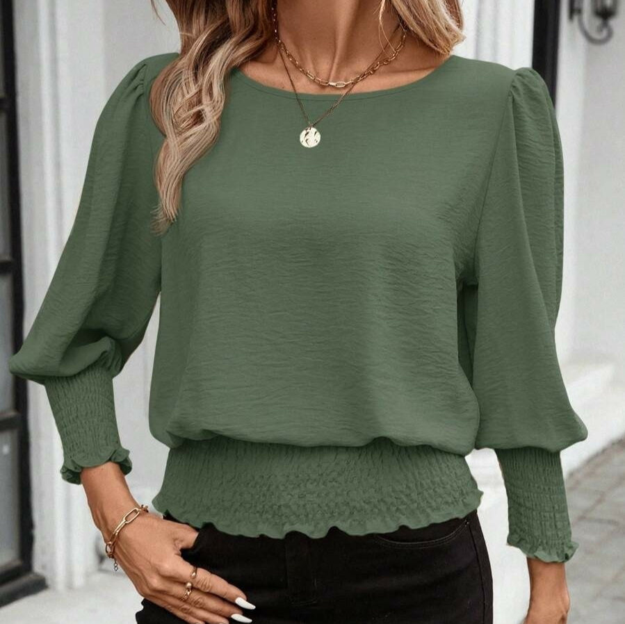 Camicia ampia e comoda con scollo rotondo e maniche a lanterna, tinta unita