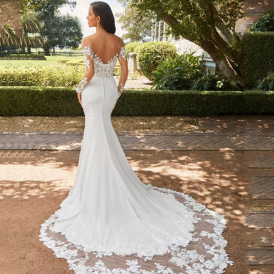 Abito da sposa a sirena in pizzo con maniche lunghe e schiena scoperta