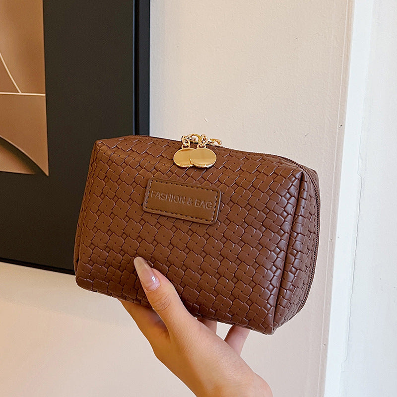 Borsa cosmetica con motivo intrecciato in stile classico