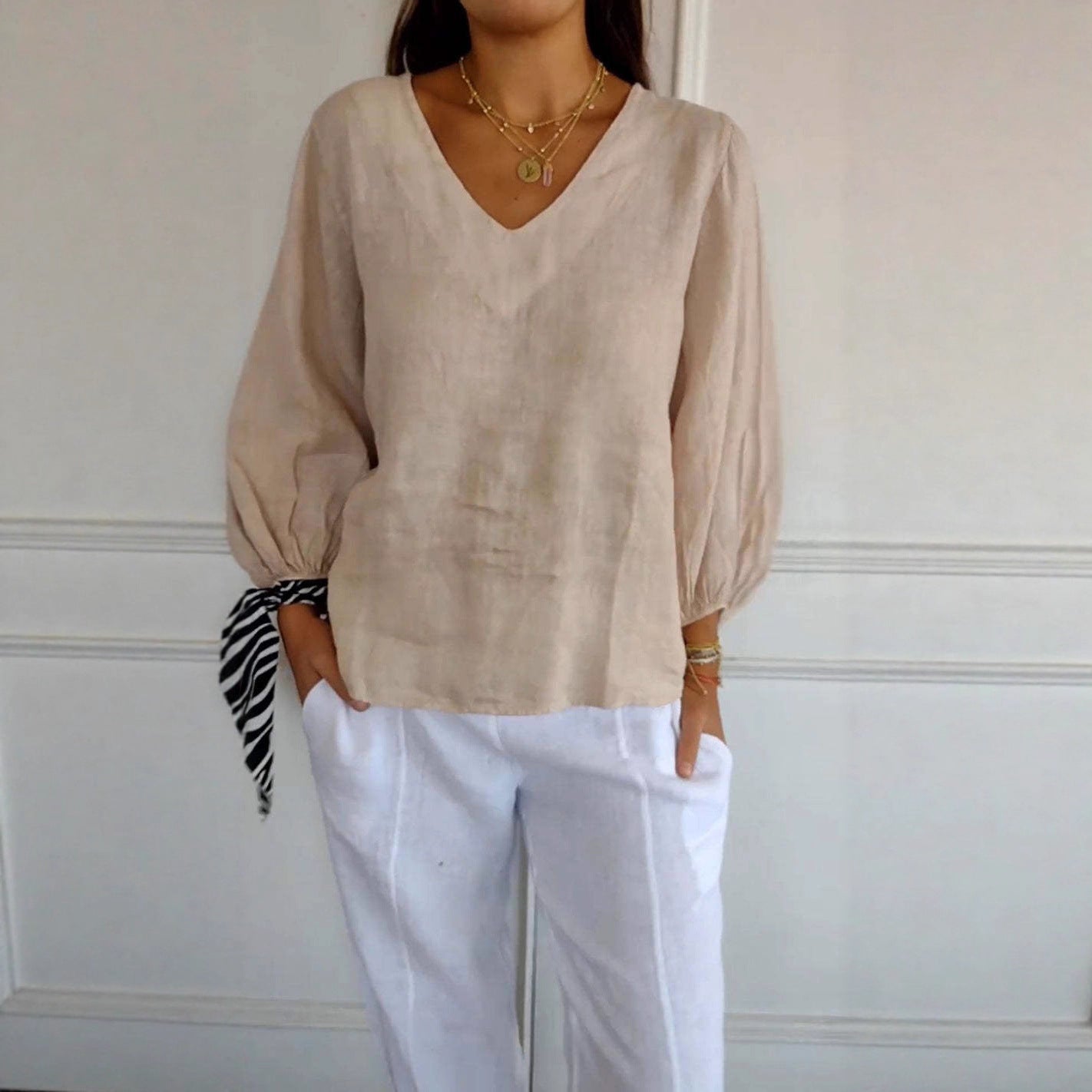 T-shirt da donna a maniche lunghe con scollo a V a tinta unita