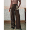 Pantaloni eleganti a pieghe da donna con una tasca alla moda impreziosita da perle