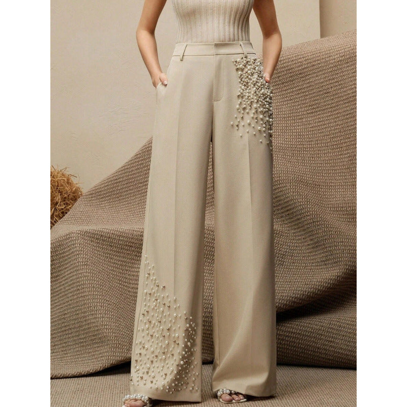 Pantaloni eleganti a pieghe da donna con una tasca alla moda impreziosita da perle