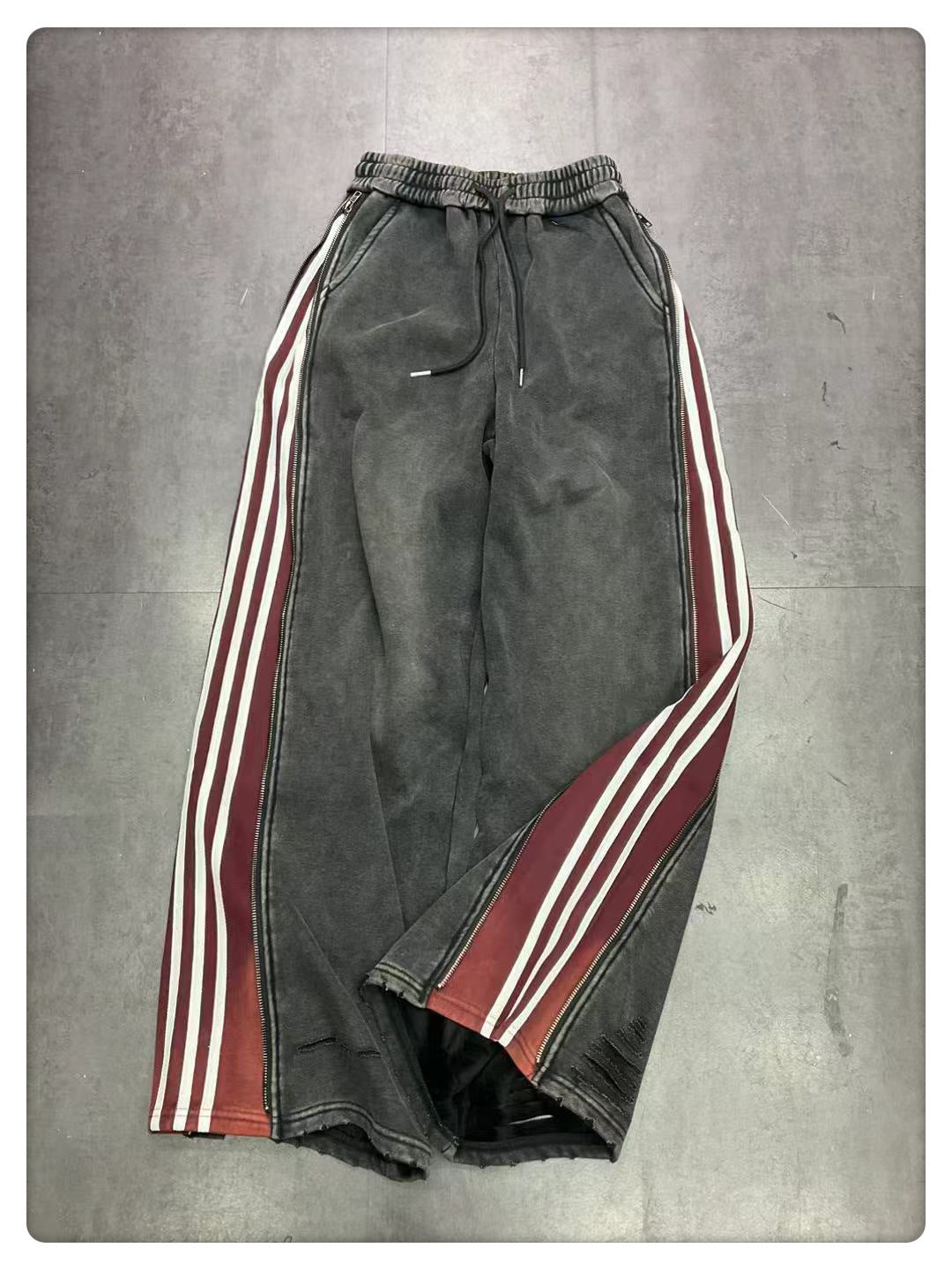 Pantaloni larghi a gamba larga con cerniera laterale bidirezionale e tre barre Design Sense