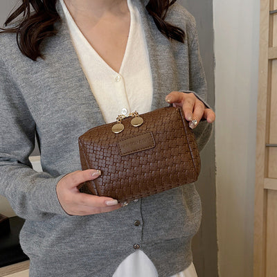 Borsa cosmetica con motivo intrecciato in stile classico