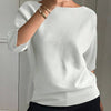 T-shirt in maglia da donna elegante e alla moda con maniche a tre quarti e scollo a barca