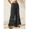 Pantaloni a zampa larghi e slavati, stile casual estivo per le vacanze, neri e consumati