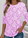Elegante maglia a maniche lunghe con scollo rotondo e stampa chic